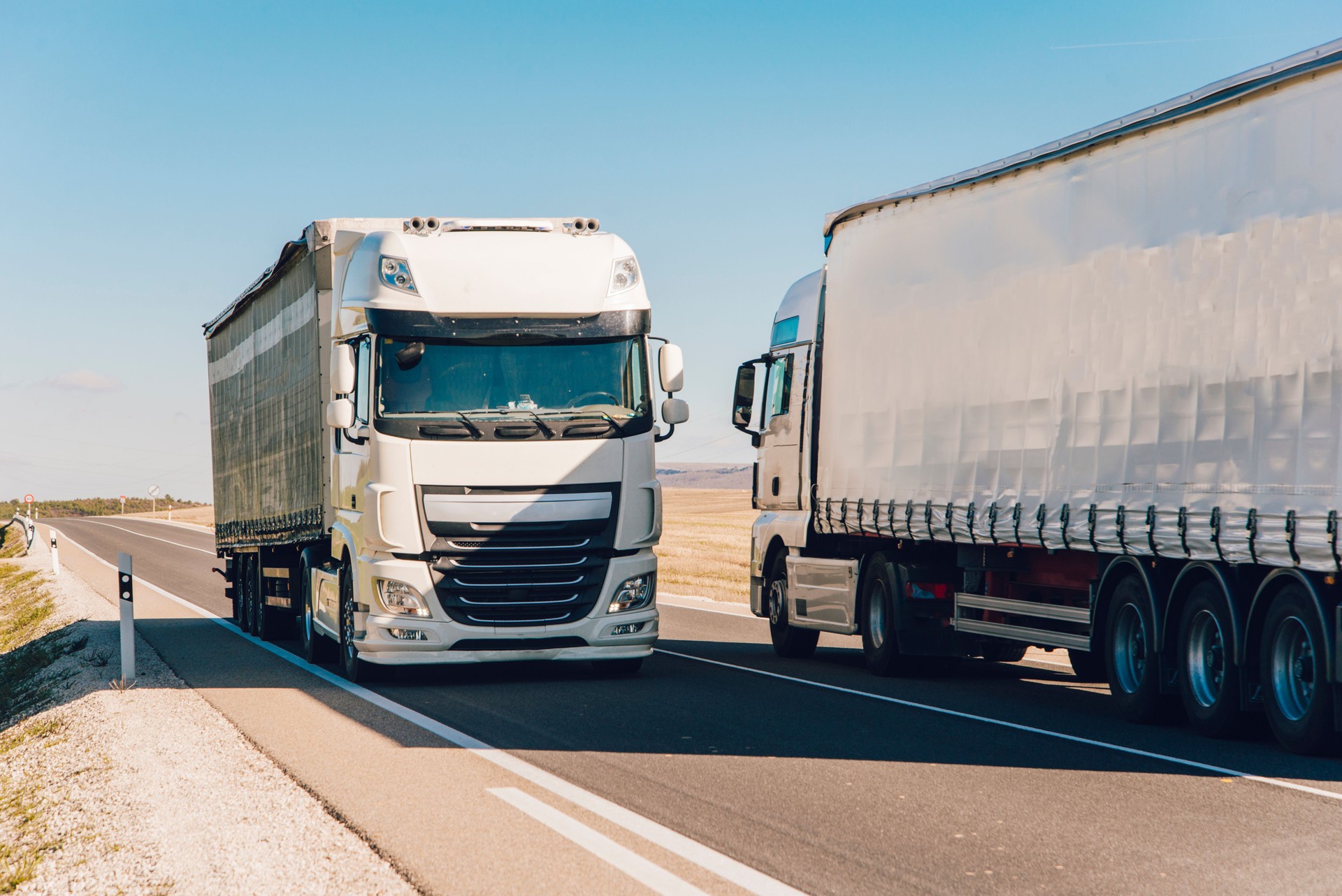 Two trucks on the road